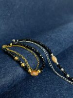 PULSEIRA DUPLA DOURADA E PRETA PONTO CHIC - Image 2